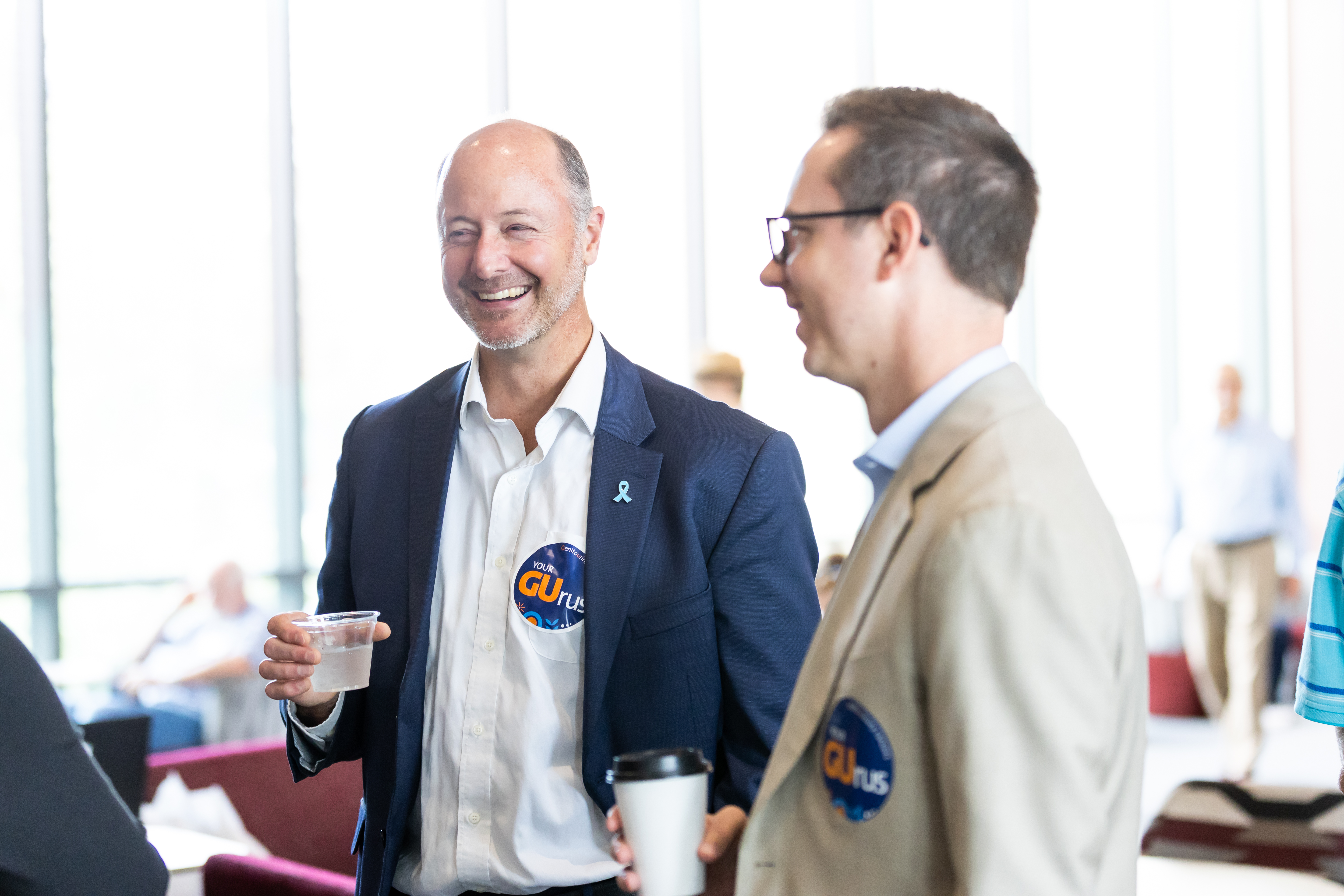 Drs. Andrew Armstrong and Dillon Cockrell chatting before the session